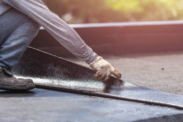 Professional Basement Waterproofing technician working in East Bethany, NY